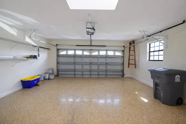 an empty room with windows and toys