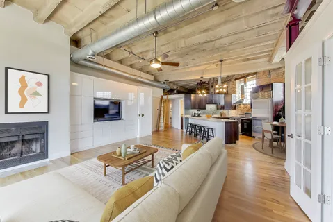 a living room with lots of furniture and a flat screen tv