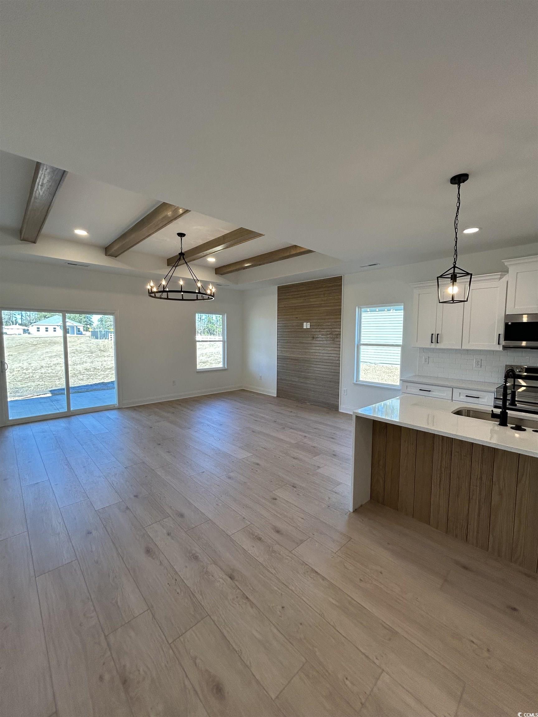 518 War Eagle Court Longs, SC 29568 - Photo 11 of 23 Kitchen with decorative light fixtures, white cabi