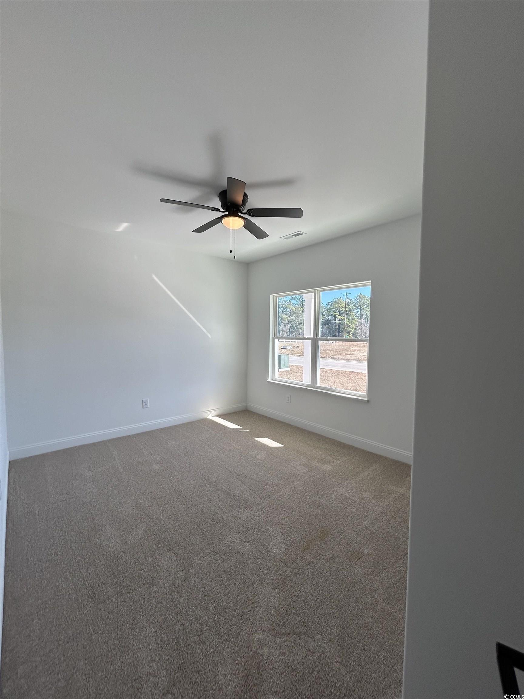 518 War Eagle Court Longs, SC 29568 - Photo 3 of 23 Carpeted spare room featuring ceiling fan