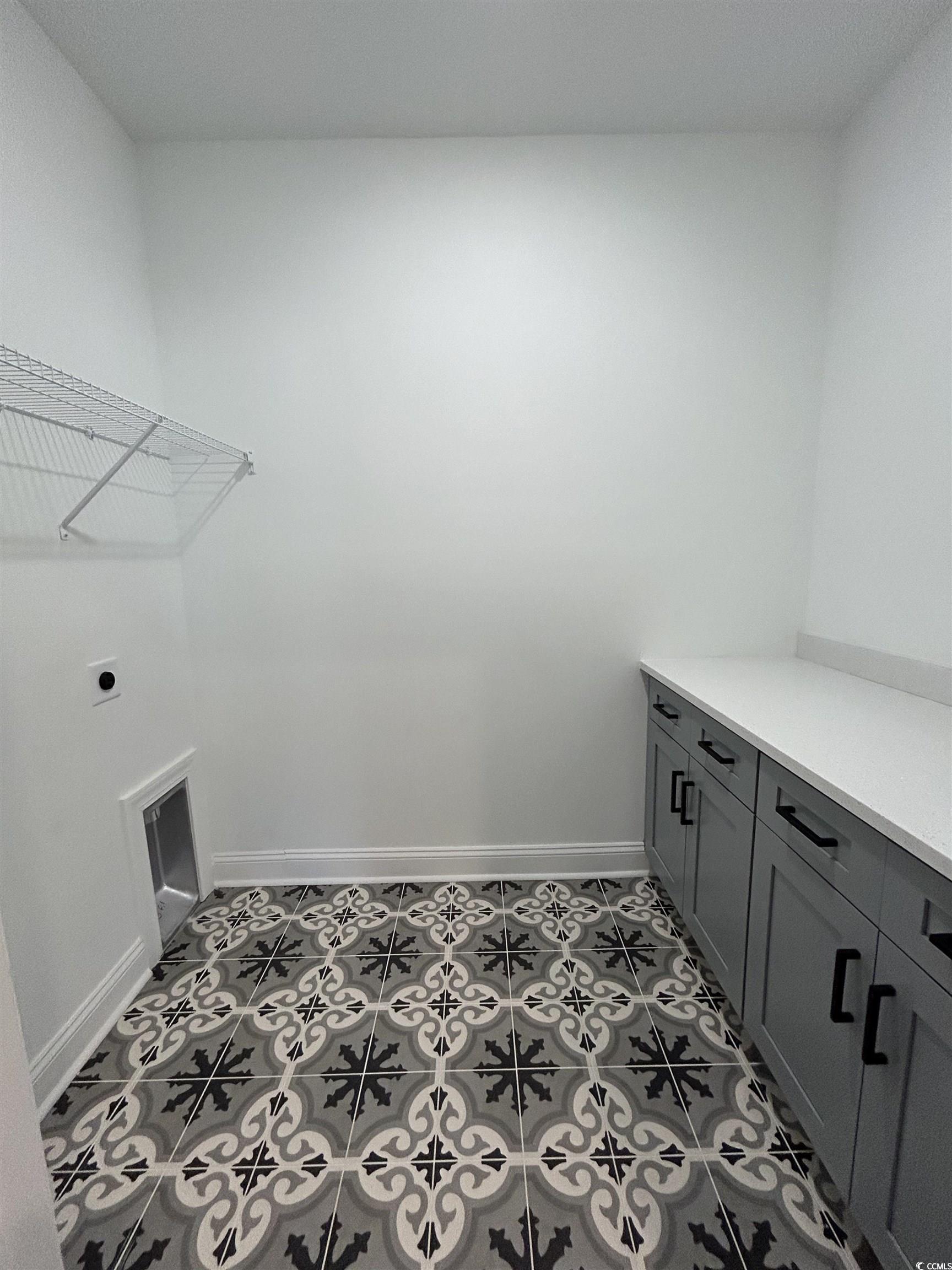 518 War Eagle Court Longs, SC 29568 - Photo 7 of 23 Laundry room with cabinets, tile patterned floorin