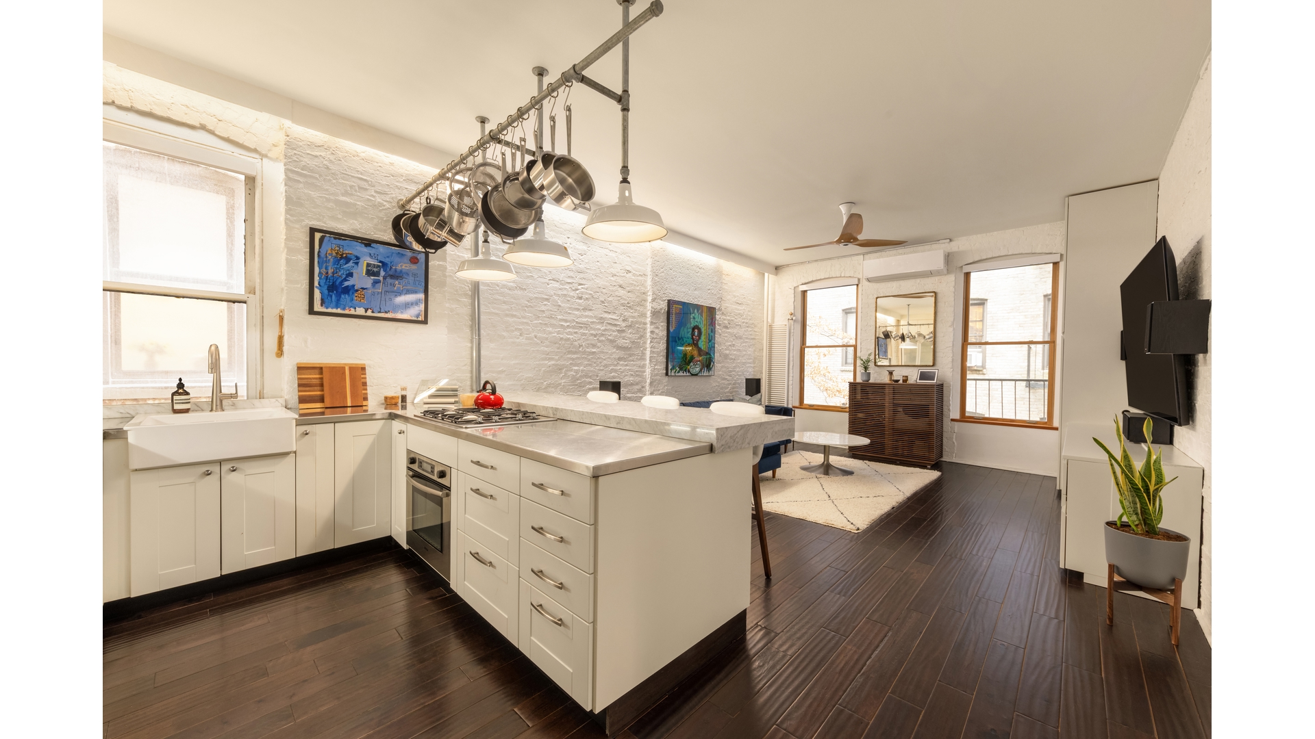 396 3rd Street, Unit SIX Brooklyn, NY 11215 - Photo 2 of 11 a kitchen with a sink dishwasher stove and wooden floor