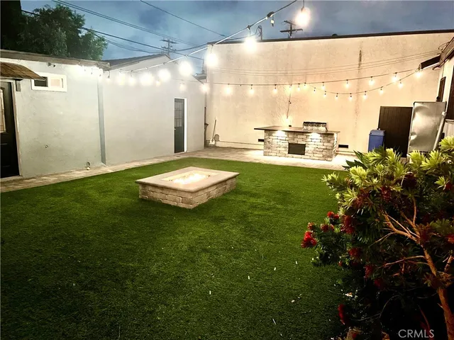 a view of a patio with table and chairs and potted plants