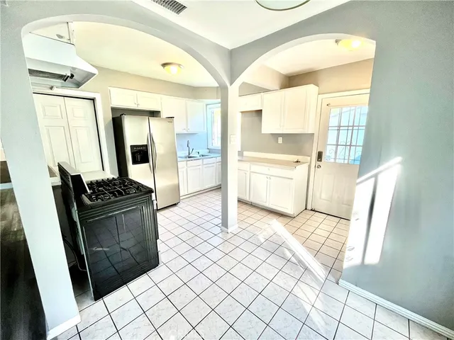 a living room with granite countertop furniture and a fireplace