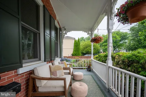 a view of balcony with furniture
