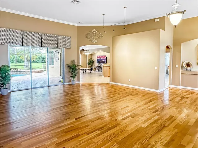 a view of a livingroom with furniture window and wooden floor