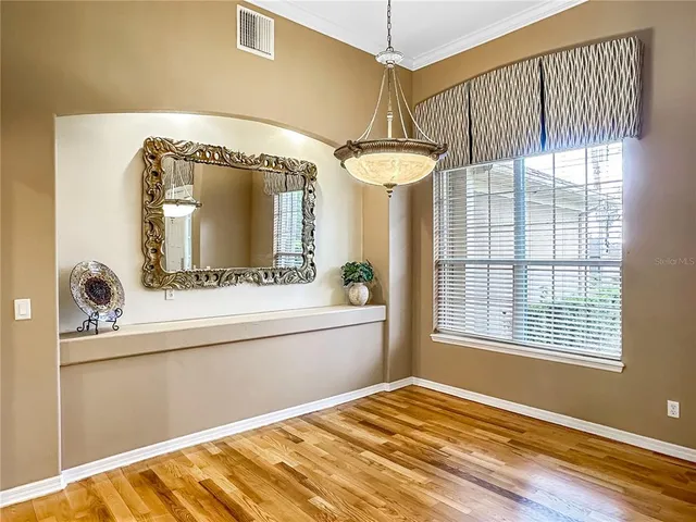 a bedroom with a bed and a mirror