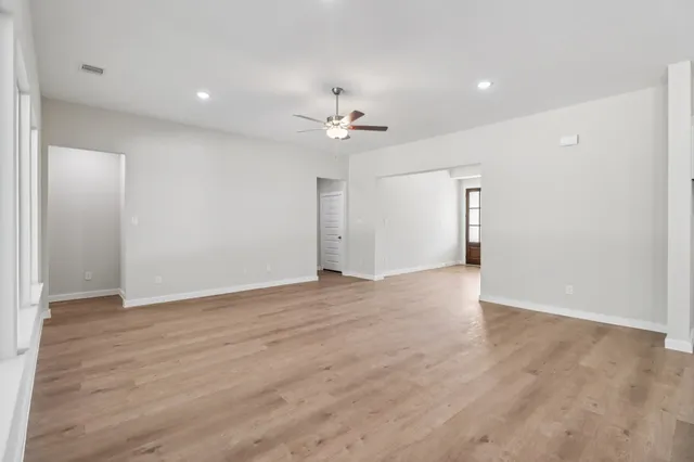 a view of kitchen with wooden floor and window