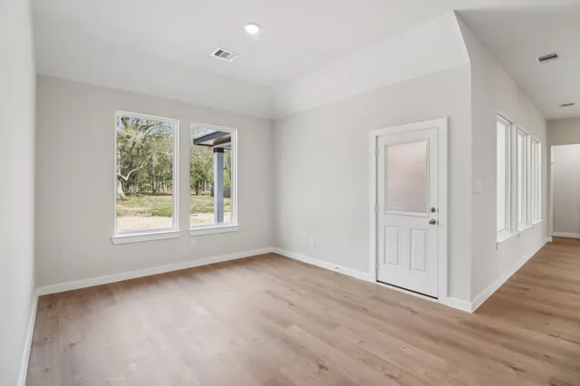a view of an empty room with a window