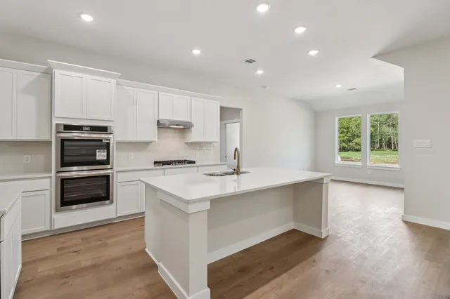 a view of kitchen with wooden floor