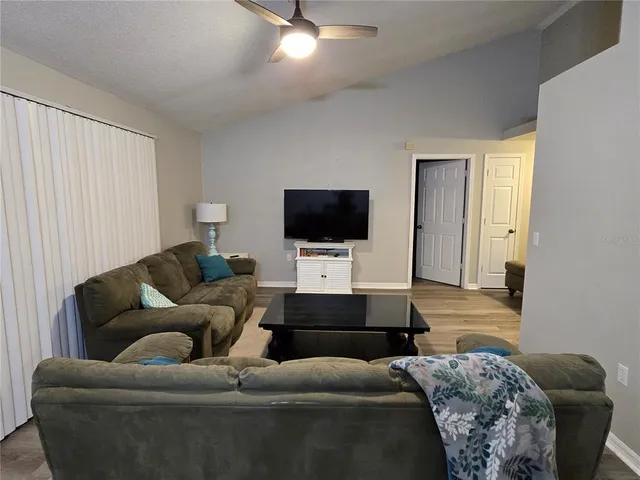 a living room with a couch and a flat screen tv