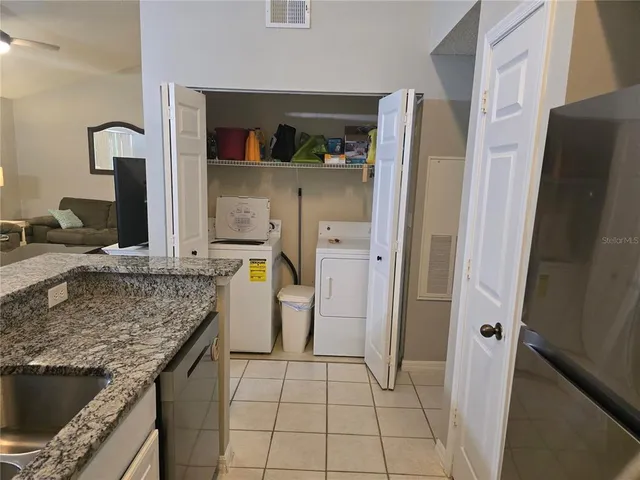 a kitchen with a sink stove and refrigerator