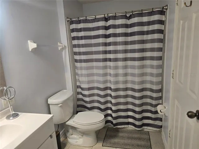 a bathroom with a toilet and a sink