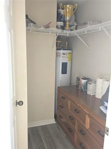 a view of a kitchen with a table and chairs