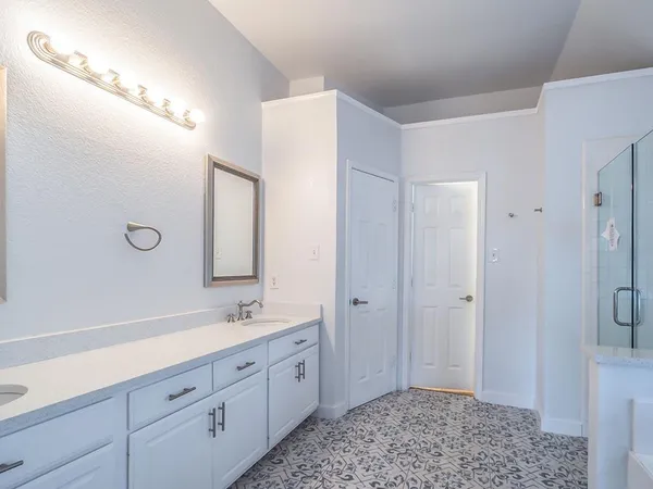 a bathroom with a bathtub and a shower