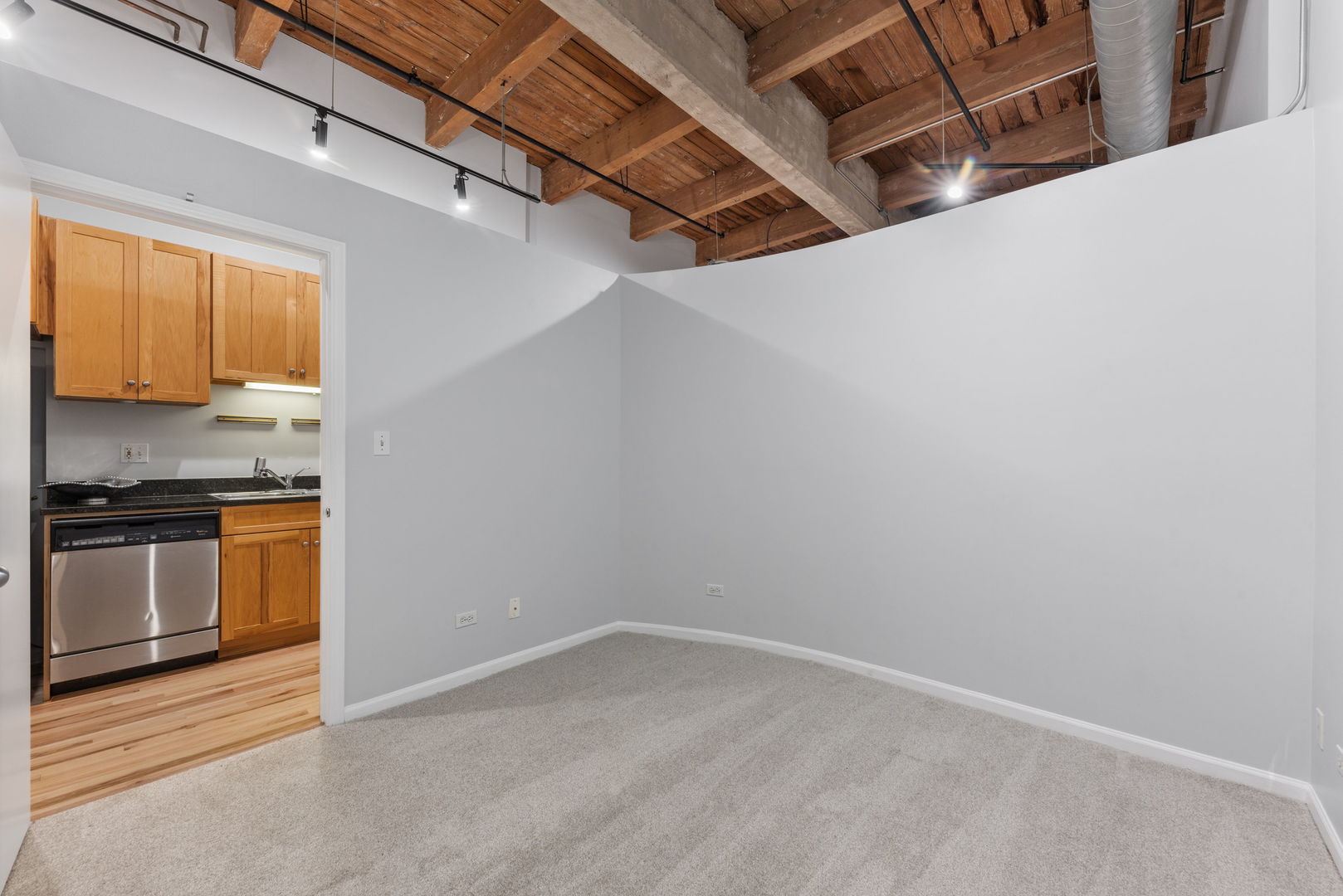 215 North Aberdeen Street, Unit 202B Chicago, IL 60607 - Photo 11 of 16 a view of a kitchen with a sink and a stove