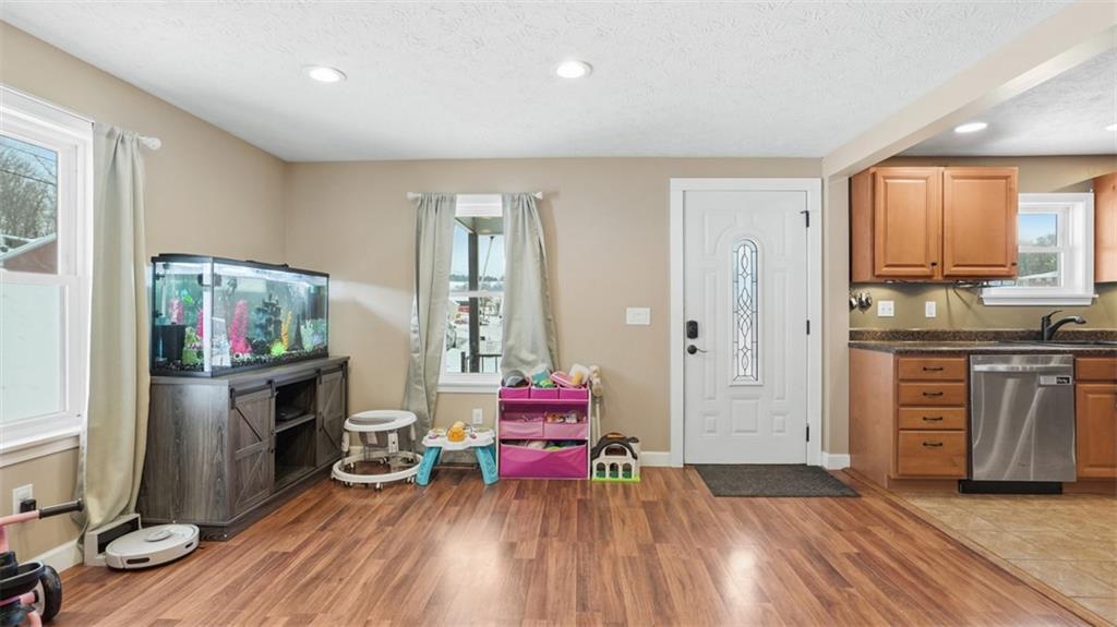 100 Stella Street Burgettstown, PA 15021 - Photo 12 of 34 Far End of the Living Room Area looking at the Dinning Area and Inside of the Front Door