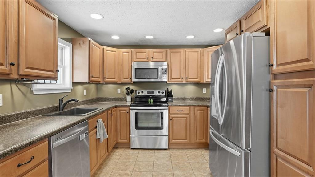 100 Stella Street Burgettstown, PA 15021 - Photo 14 of 34 Looking into the Kitchen from the Dining Area