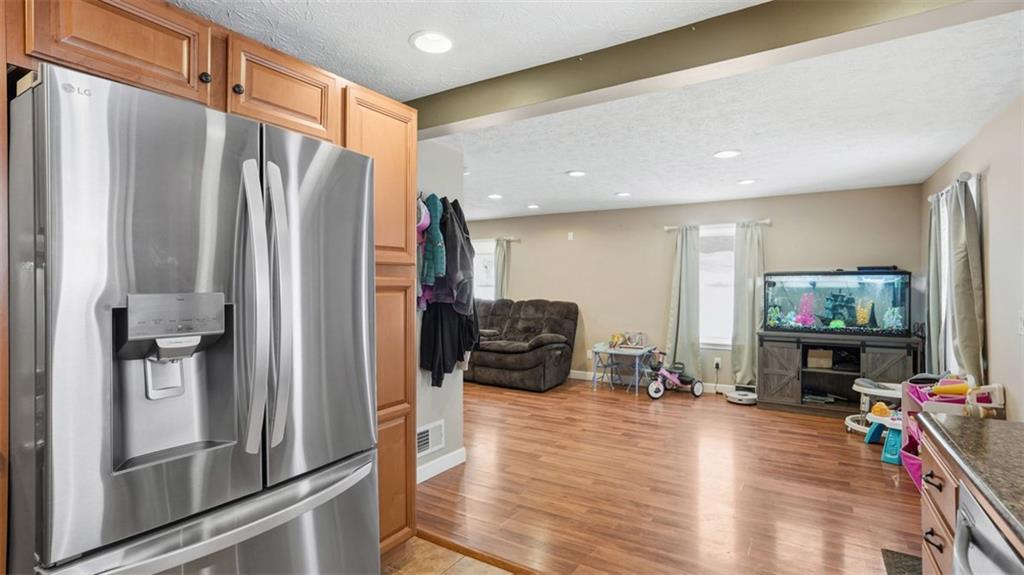100 Stella Street Burgettstown, PA 15021 - Photo 15 of 34 Kitchen looking into Dining Area and Living Room