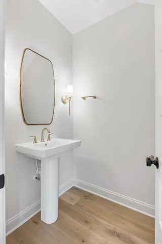 a bathroom with a sink and mirror