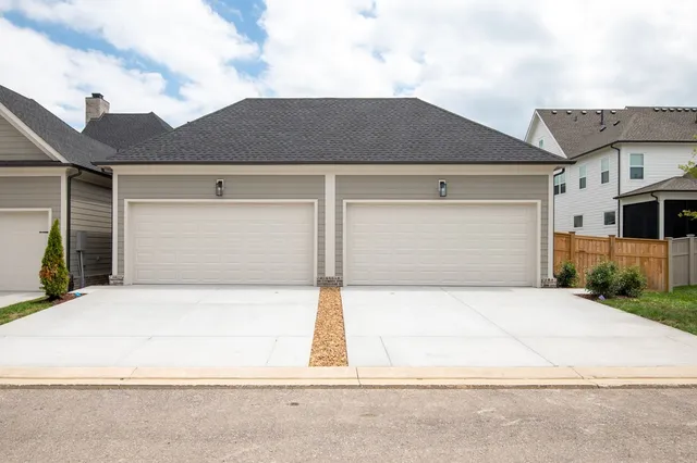 a front view of a house with a garage