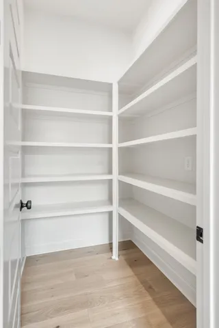 a view of a room with shelf on the wall