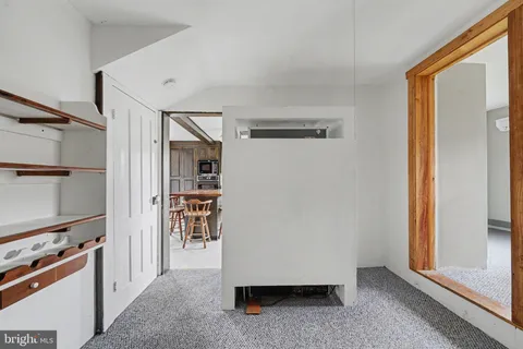 a view of kitchen with furniture and a window