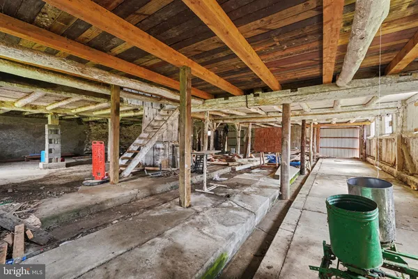 a view of a hall with wooden floors