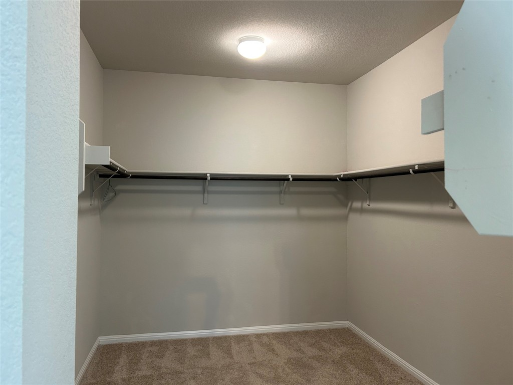 2212 Baugh Road Austin, TX 78754 - Photo 18 of 36 Walking-in closet with light carpet