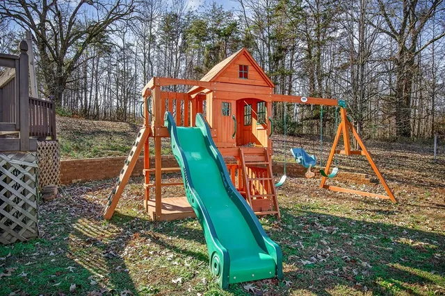a view of a park with iron fence