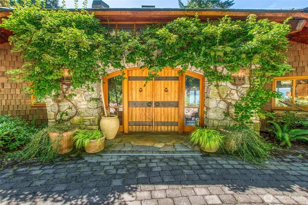 a living room filled with furniture and a large window