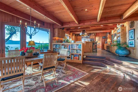 a view of a patio with table and chairs potted plants