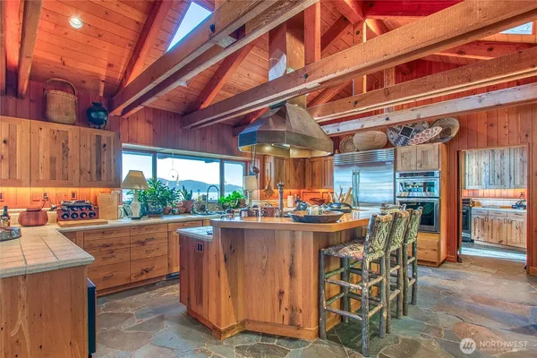 a bedroom with bed and a large window