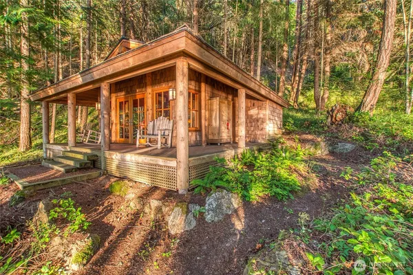 a view of a balcony with a forest