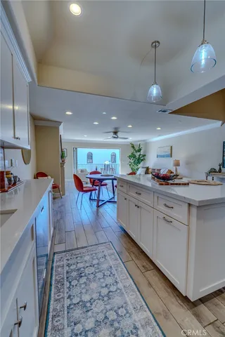 a bedroom with furniture and a wooden floor