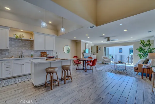 a living room with furniture fireplace and window