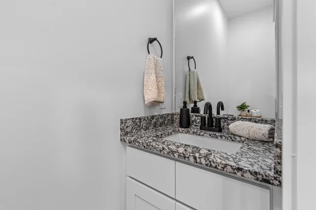 a bathroom with sink and mirror