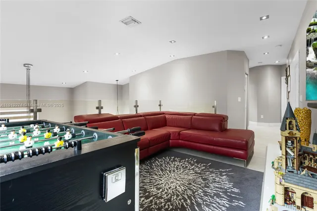 a living room with lots of furniture and a table