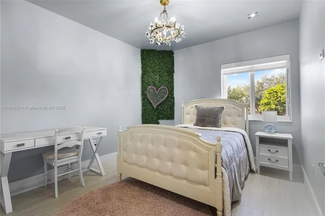 a bedroom with a bed and a table