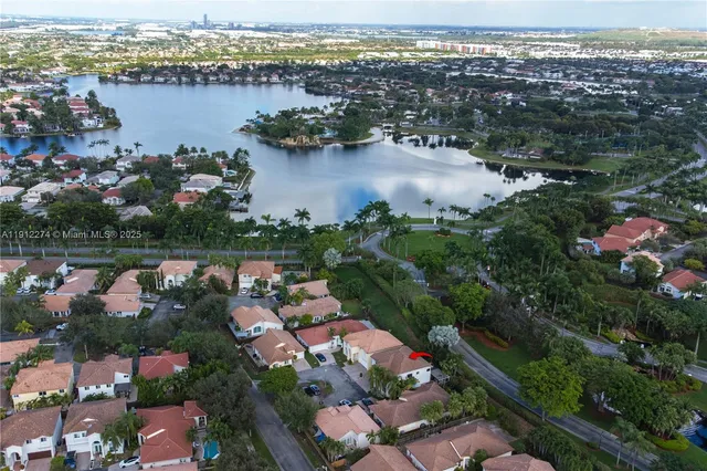 an aerial view of lake and city space