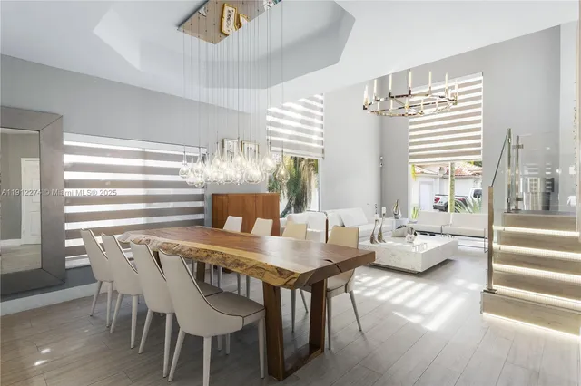a dining room with furniture and wooden floor