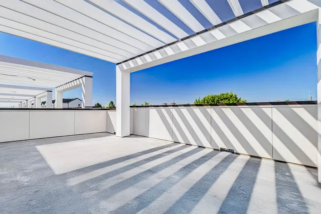 a view of a room with a bed and cabinet