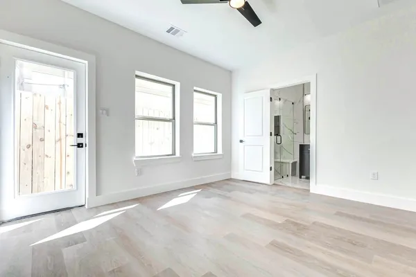a view of an empty room with a window