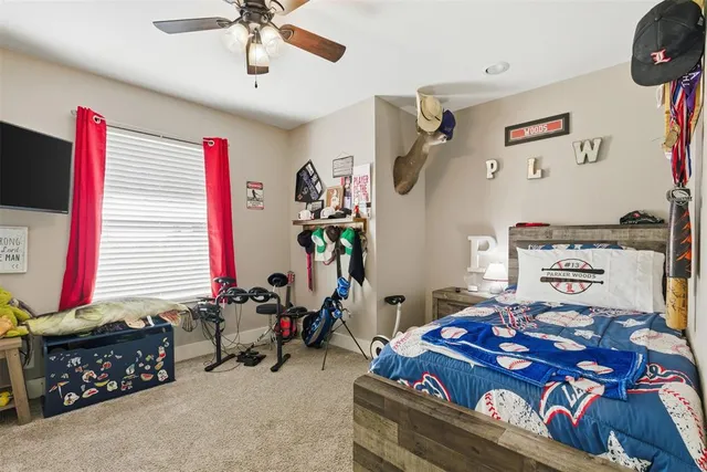 a bedroom with furniture and a window