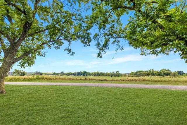a view of a lake with houses in the background