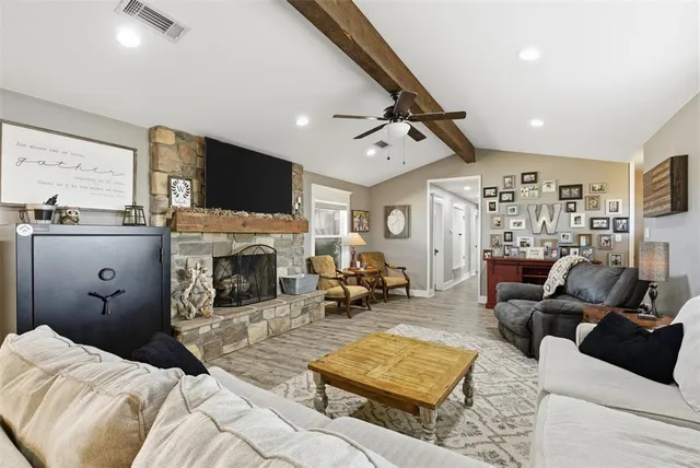 a bedroom with furniture and a fireplace