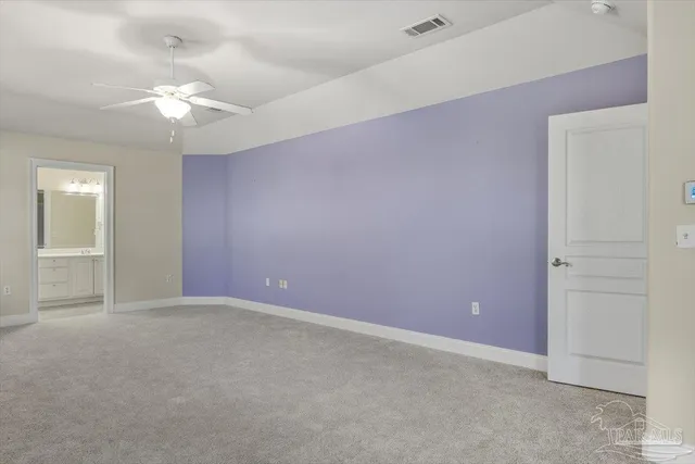 an empty room that has a glass door