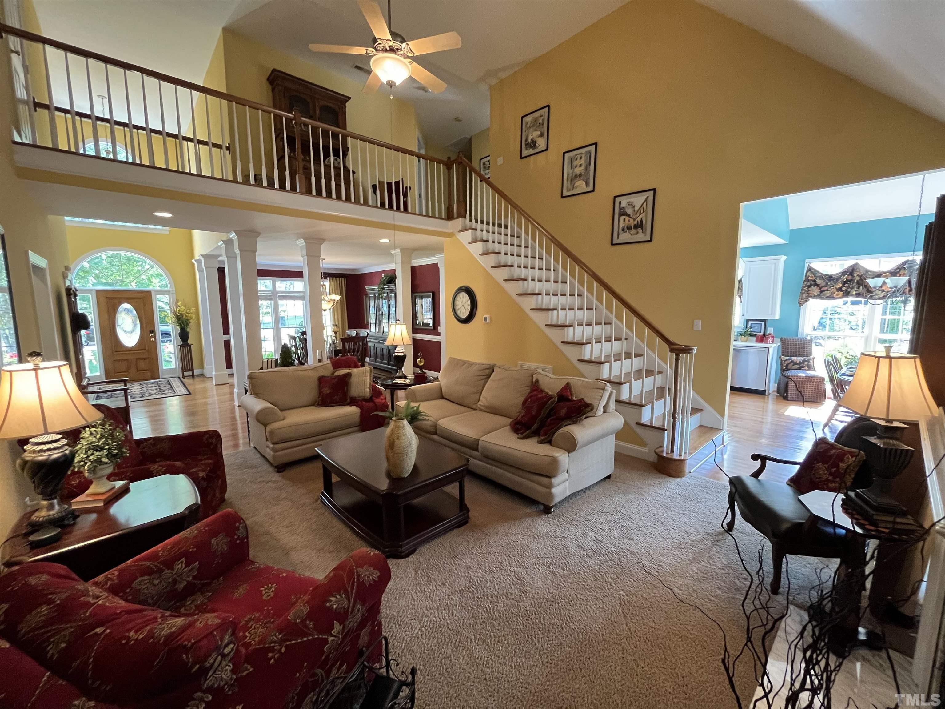 204 Challenge Road Raleigh, NC 27603 - Photo 13 of 42 a living room with furniture and a potted plant