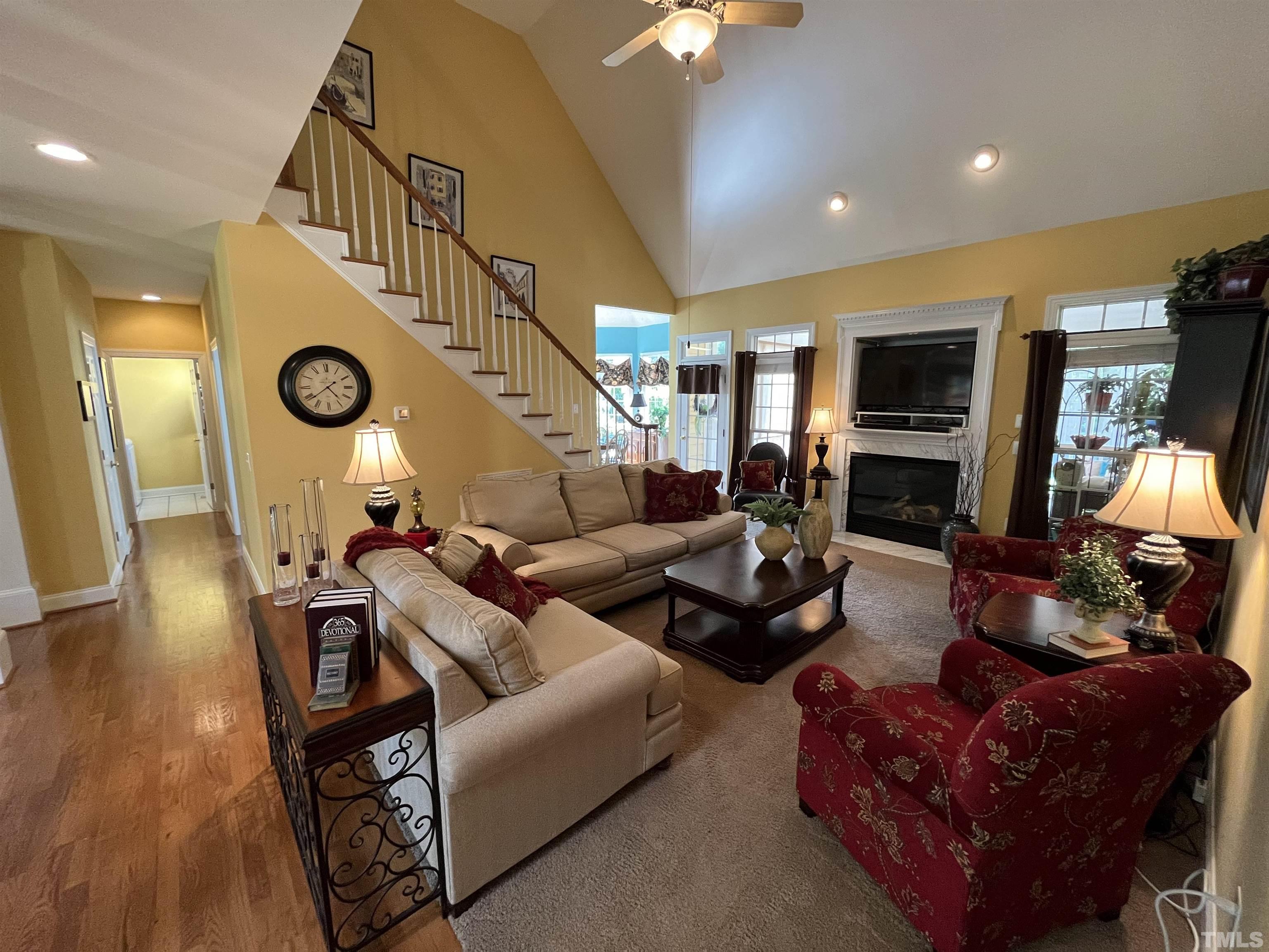 204 Challenge Road Raleigh, NC 27603 - Photo 14 of 42 a living room with furniture and a flat screen tv
