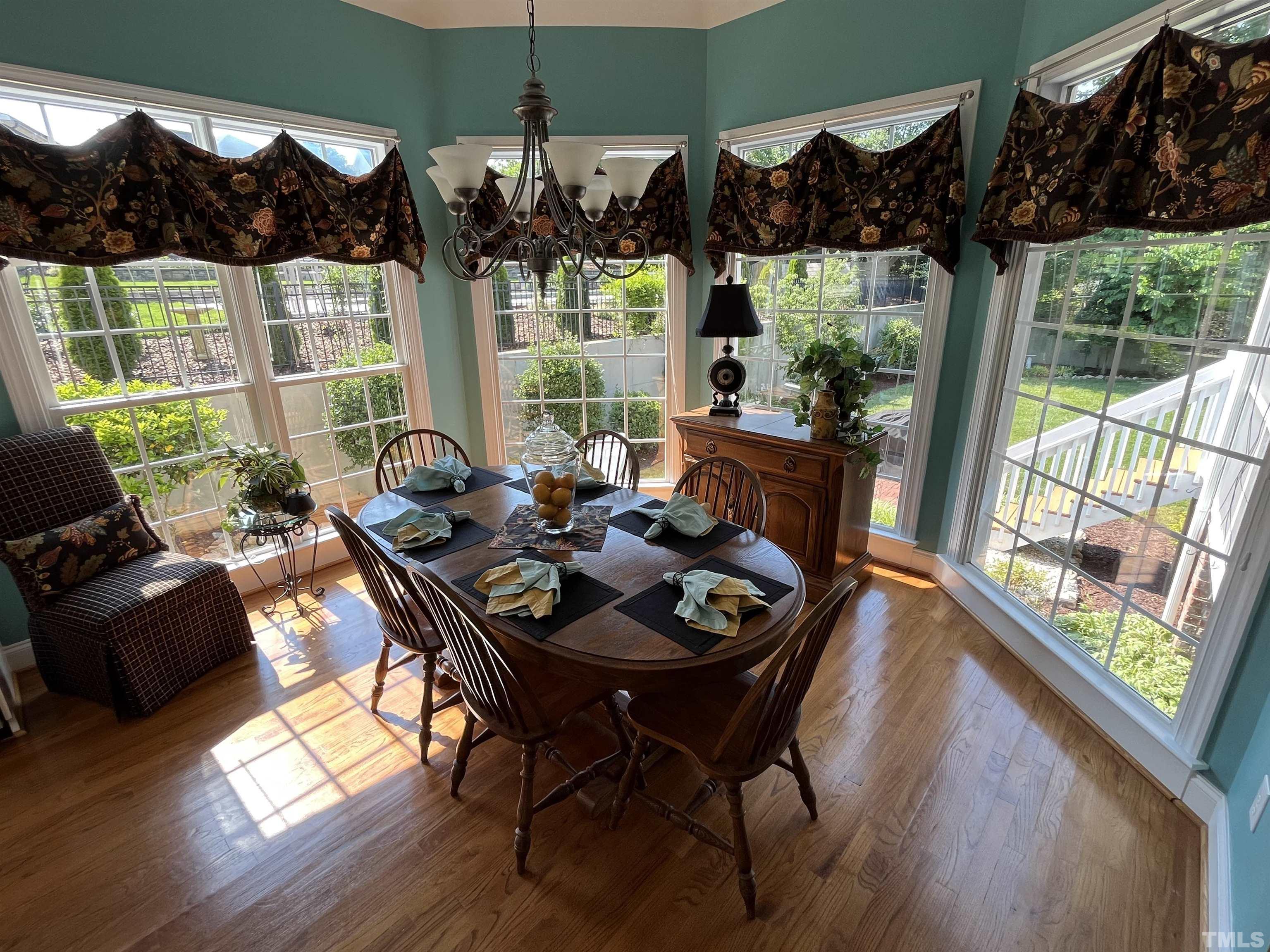 204 Challenge Road Raleigh, NC 27603 - Photo 19 of 42 a living room with furniture and a large window